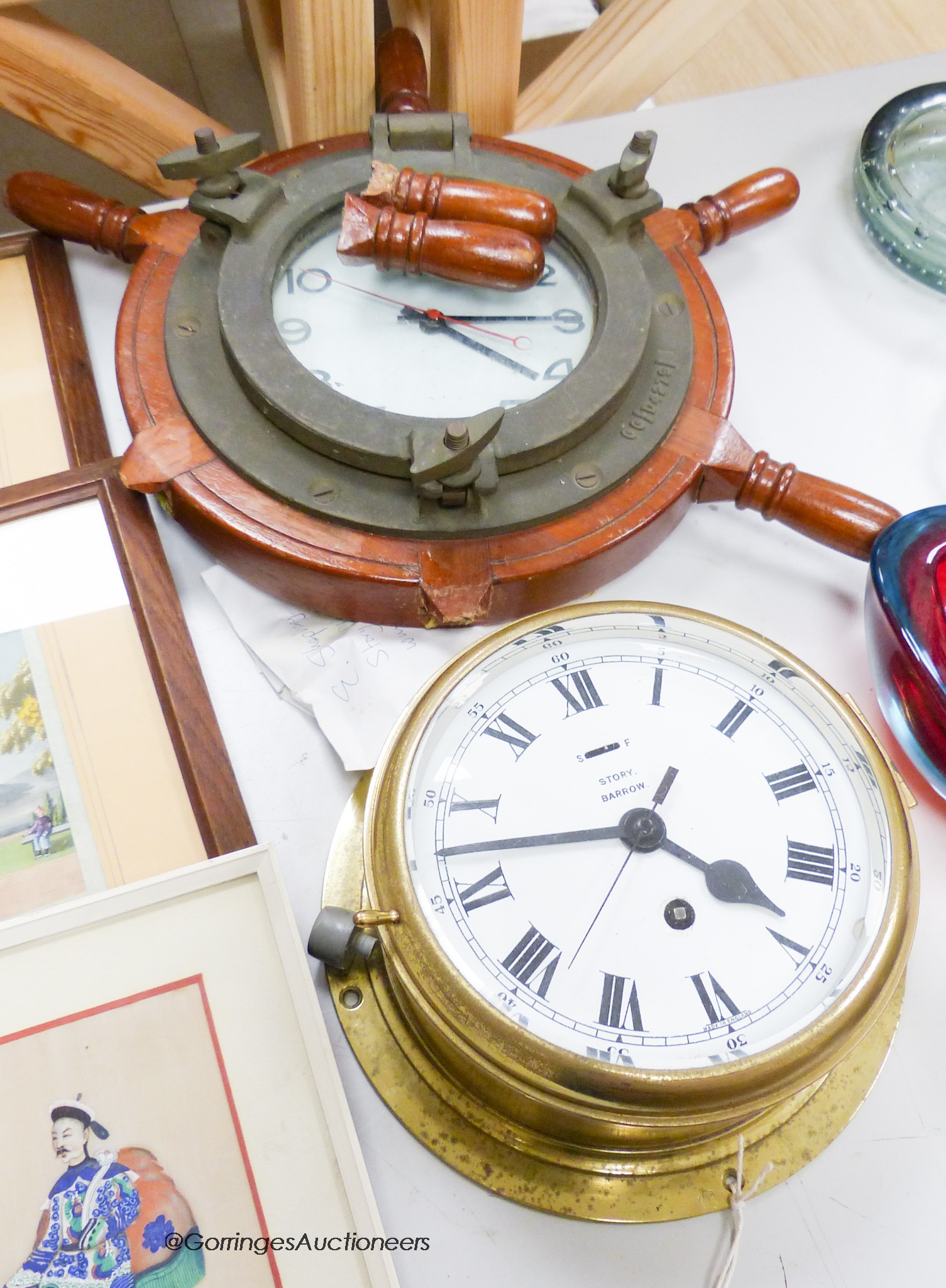 A brass bulkhead timepiece, enamelled dial signed Story, Barrow, dial 17cm, and a ship's wheel wall timepiece by Bayard